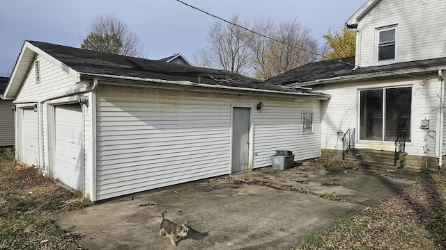 view of side of property with a garage