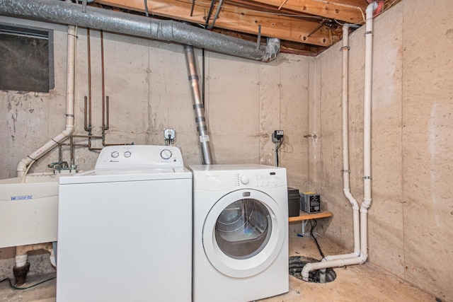 laundry area featuring sink and washing machine and clothes dryer