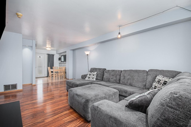 living room with dark hardwood / wood-style floors