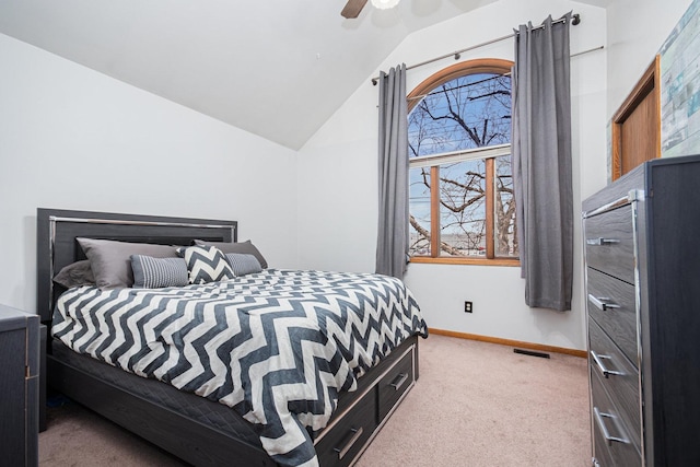 bedroom with carpet flooring, ceiling fan, and lofted ceiling