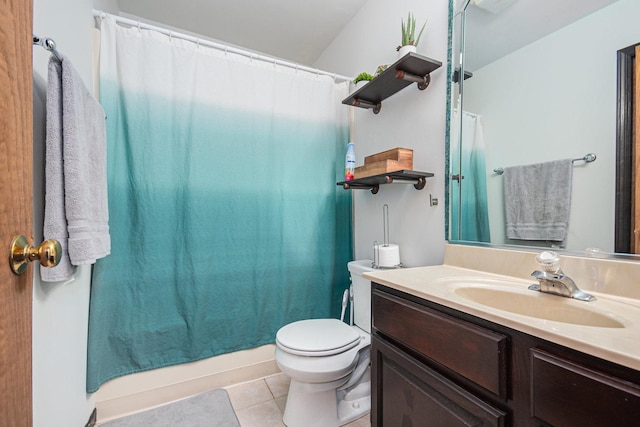 bathroom with tile patterned floors, vanity, and toilet