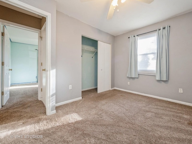 unfurnished bedroom featuring ceiling fan, a closet, and carpet