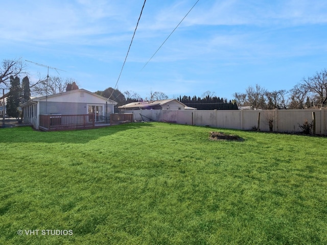 view of yard featuring a deck