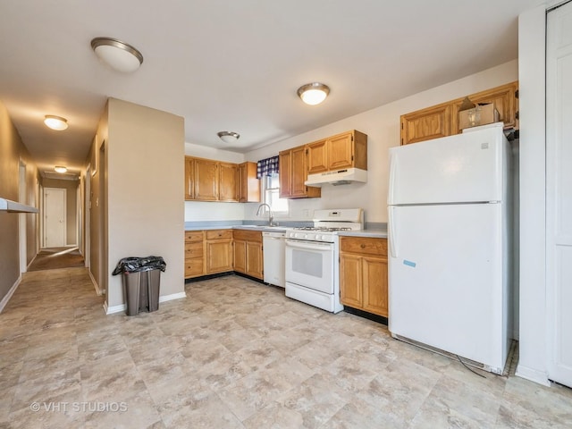 kitchen featuring sink and white appliances