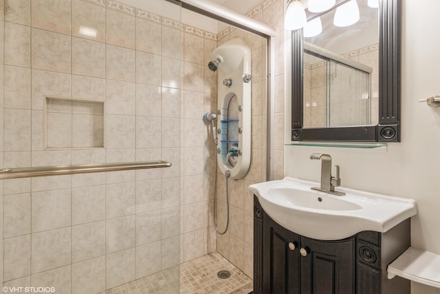 bathroom with vanity and a shower with door