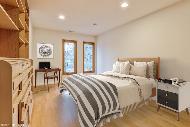 bedroom with light hardwood / wood-style floors