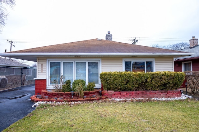 view of home's exterior with a yard