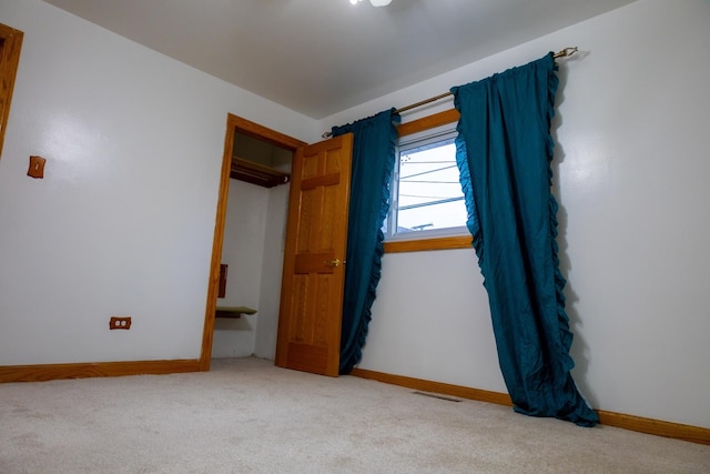 unfurnished bedroom with light carpet