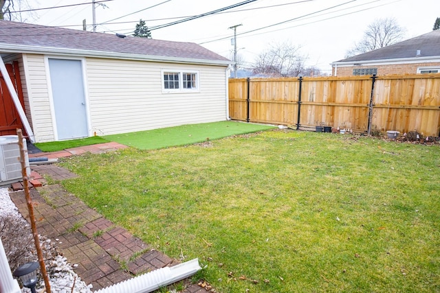 view of yard featuring an outbuilding and central AC unit