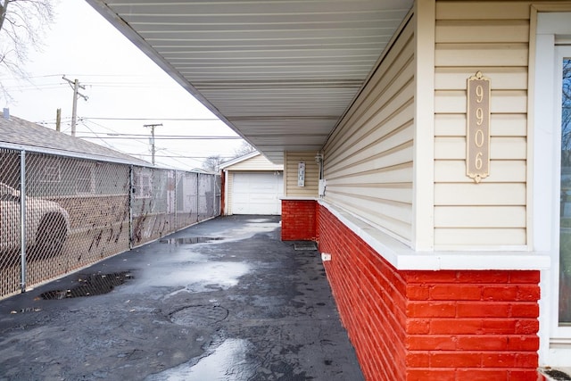 view of patio / terrace featuring a garage and an outdoor structure