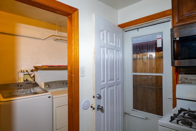 laundry room with independent washer and dryer