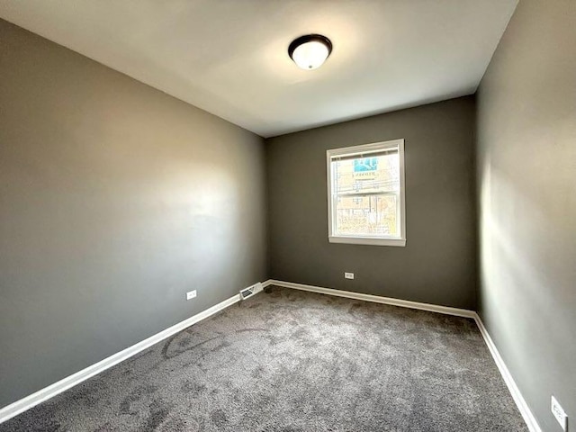 spare room featuring carpet floors