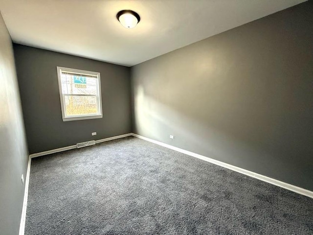 unfurnished room with carpet flooring