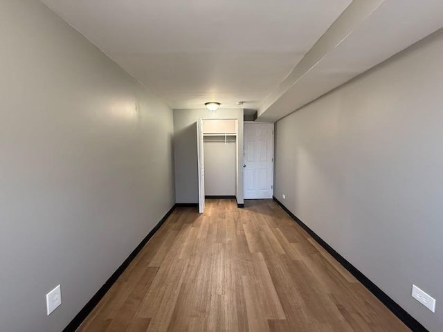 unfurnished room with light hardwood / wood-style floors