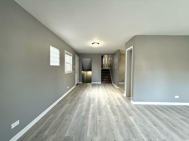 spare room featuring light hardwood / wood-style flooring