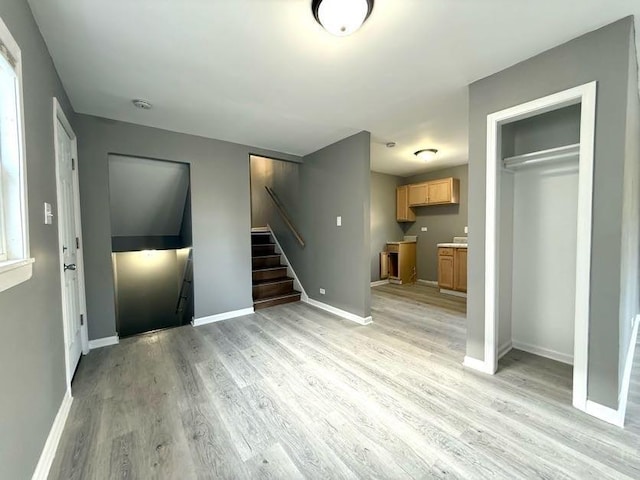 unfurnished living room with light hardwood / wood-style floors