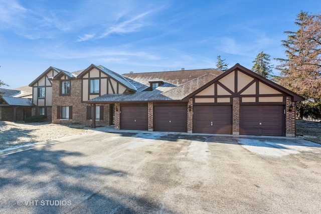 tudor home featuring a garage