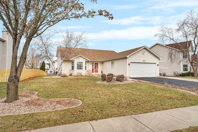 ranch-style house with a front yard and a garage