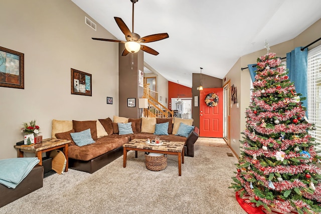 living room with carpet floors, ceiling fan, and lofted ceiling