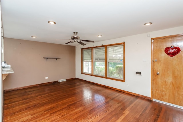 unfurnished room with wood-type flooring and ceiling fan