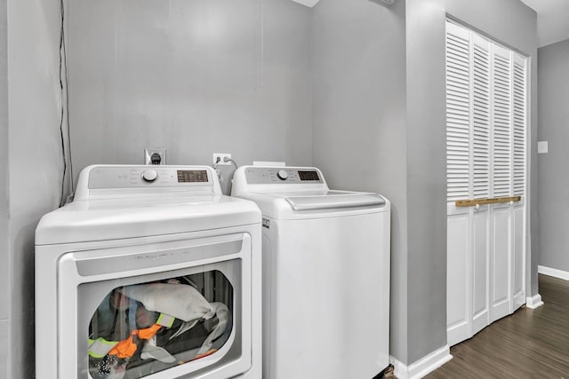 laundry room featuring dark hardwood / wood-style flooring and independent washer and dryer