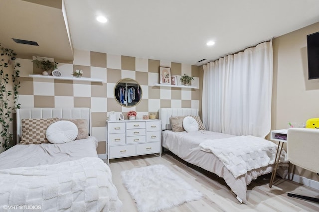 bedroom with light hardwood / wood-style flooring