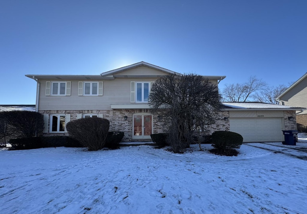 front of property with a garage