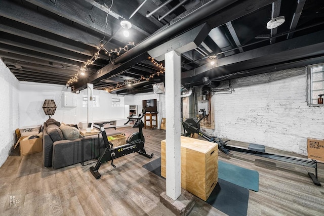 exercise area featuring hardwood / wood-style floors