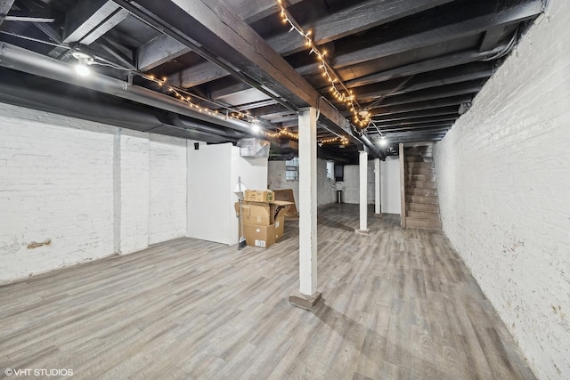 basement featuring hardwood / wood-style flooring