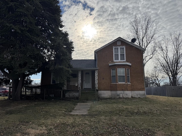 view of front of house with a front lawn and a porch