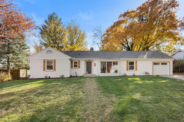 single story home featuring a front lawn and a garage