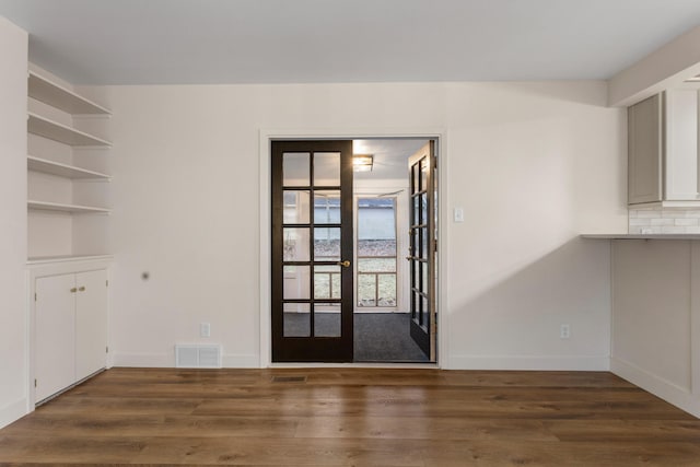 interior space with dark wood-type flooring and french doors