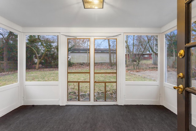 unfurnished sunroom with plenty of natural light