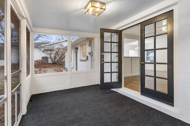 unfurnished sunroom featuring french doors