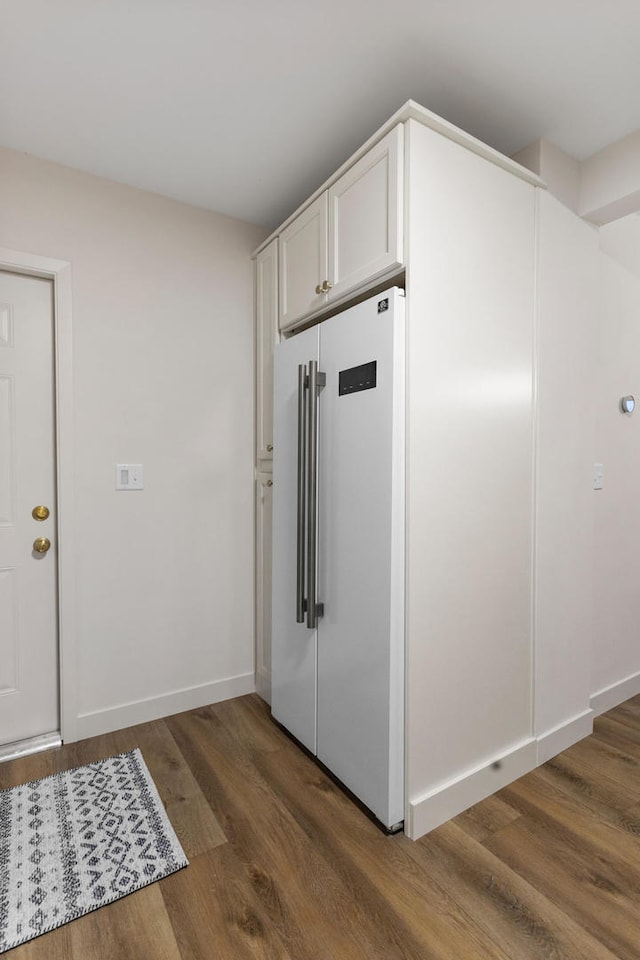 kitchen featuring white cabinets, dark hardwood / wood-style floors, and high end refrigerator