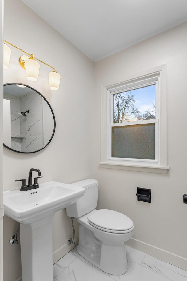 bathroom with toilet and sink