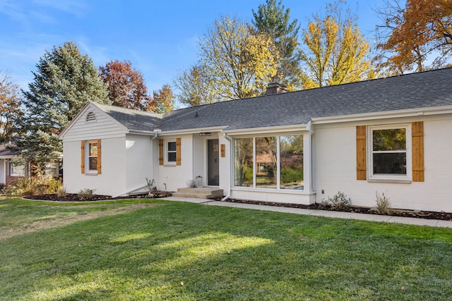 view of front of home with a front lawn