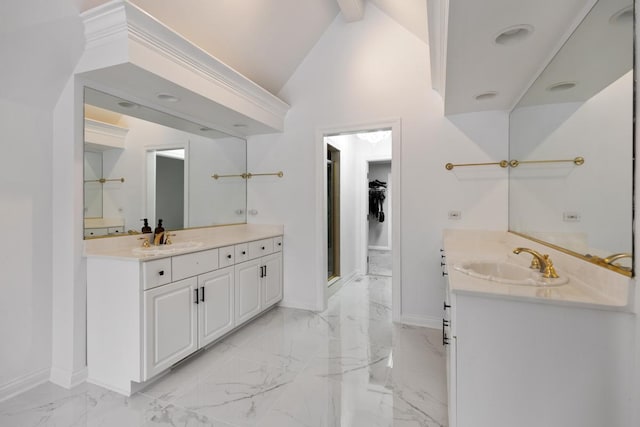 bathroom featuring vanity and lofted ceiling with beams