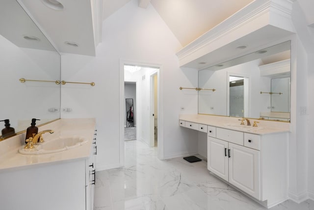 bathroom with vanity and vaulted ceiling