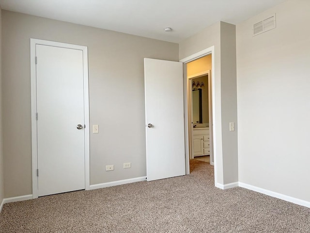 unfurnished bedroom with carpet flooring