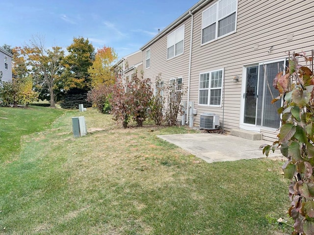 view of yard featuring a patio area and central AC