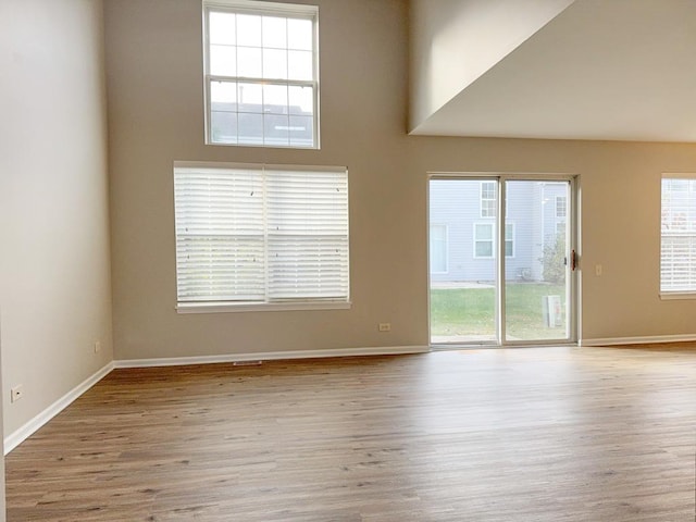 empty room with light hardwood / wood-style floors