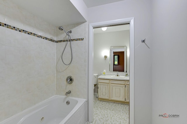 full bathroom with vanity, tiled shower / bath combo, tile patterned floors, and toilet