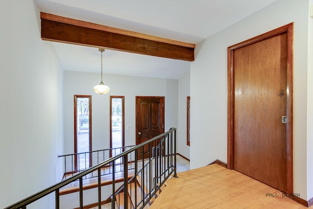 corridor featuring beamed ceiling