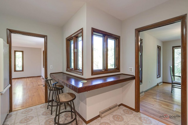 kitchen featuring white refrigerator and light hardwood / wood-style floors