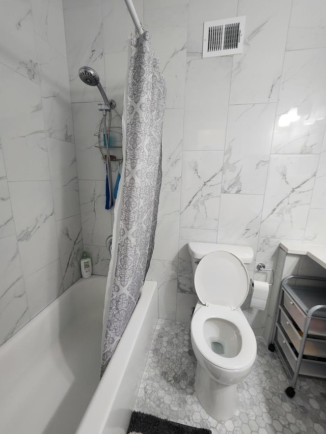 bathroom with toilet, shower / bathtub combination with curtain, and tile walls