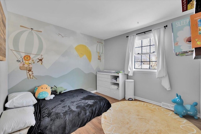 bedroom with light wood-type flooring