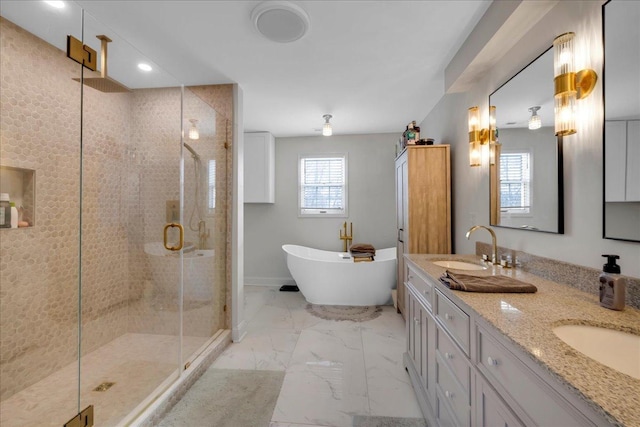 bathroom with vanity and independent shower and bath