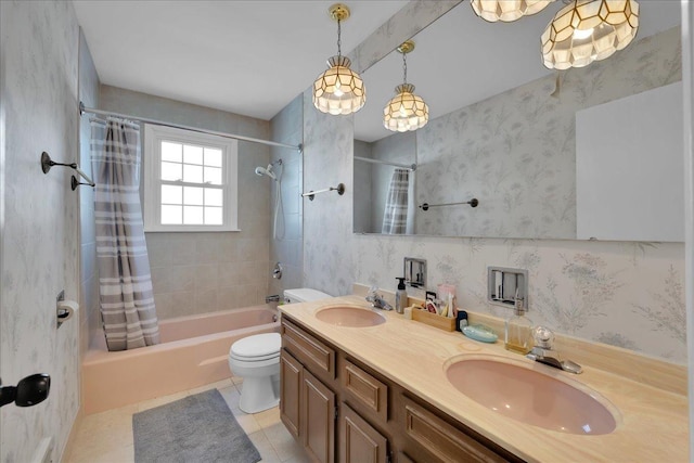 full bathroom with tile patterned floors, shower / bath combo, toilet, and vanity