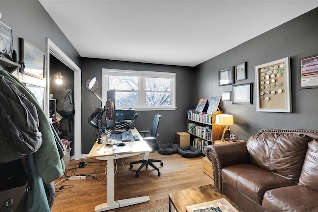 office space with wood-type flooring